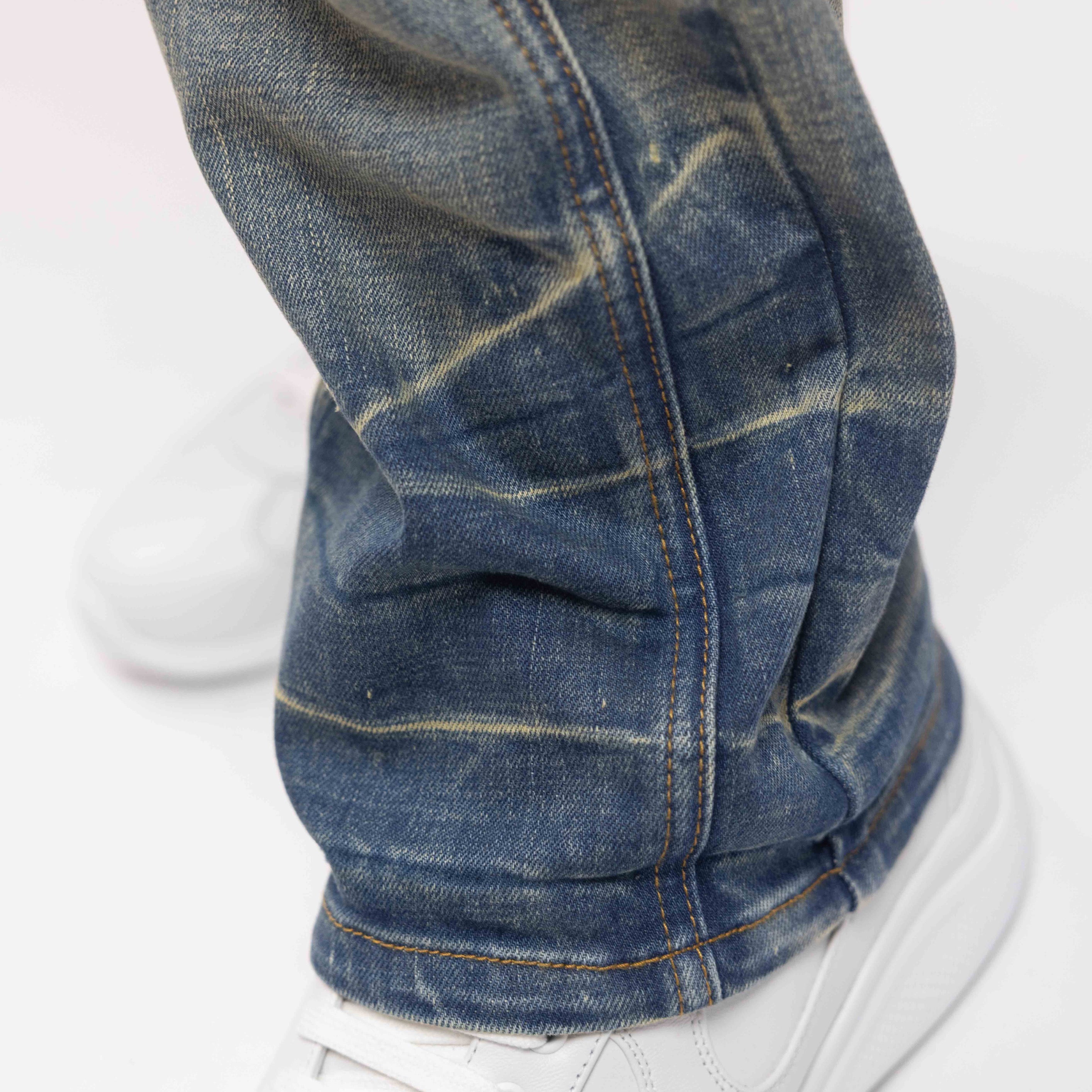 SEGMENTED WASHED DENIM JEANS
