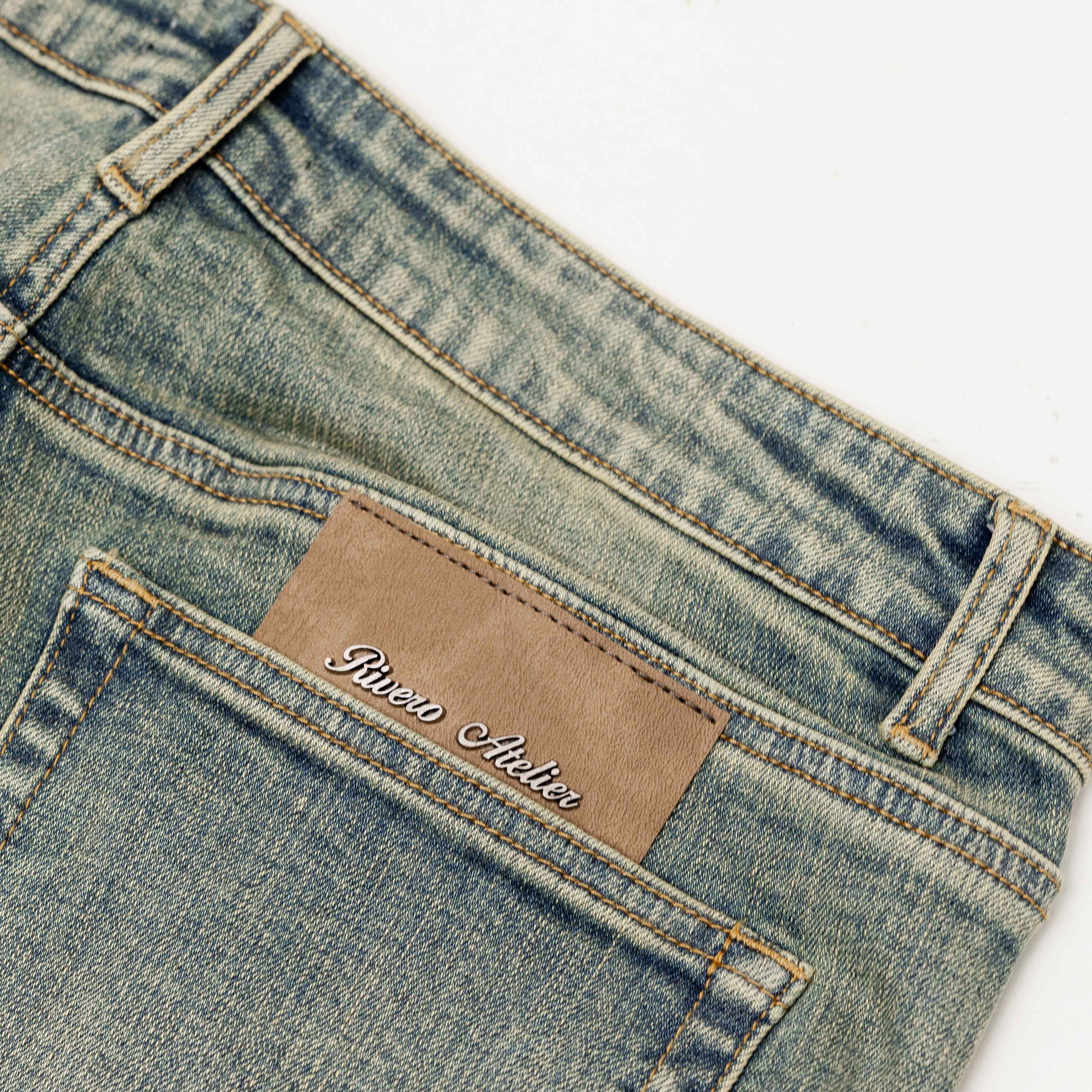 RAISED MONOGRAM BUTTONED DENIM JEANS PRE-ORDER