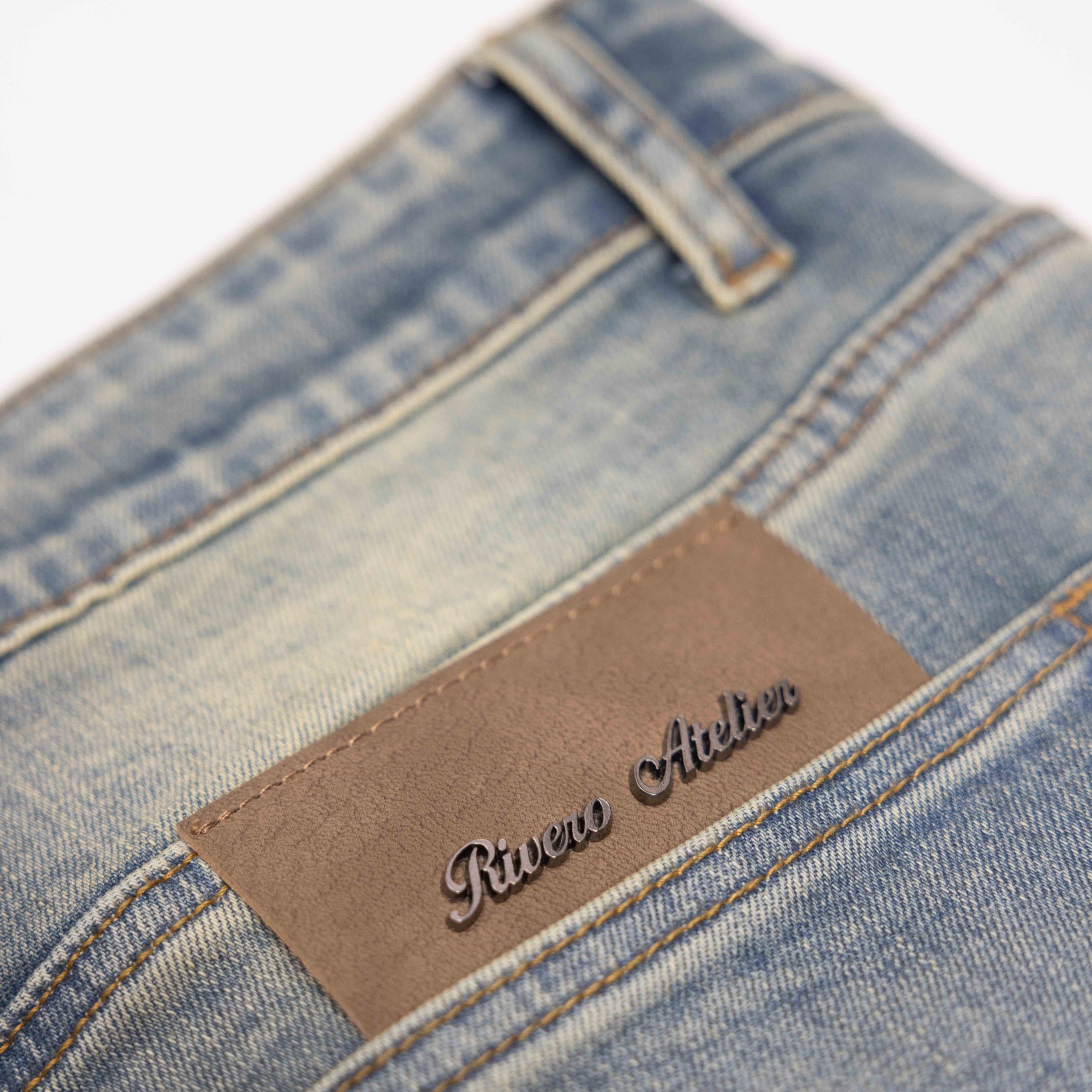 SEGMENTED WASHED DENIM JEANS