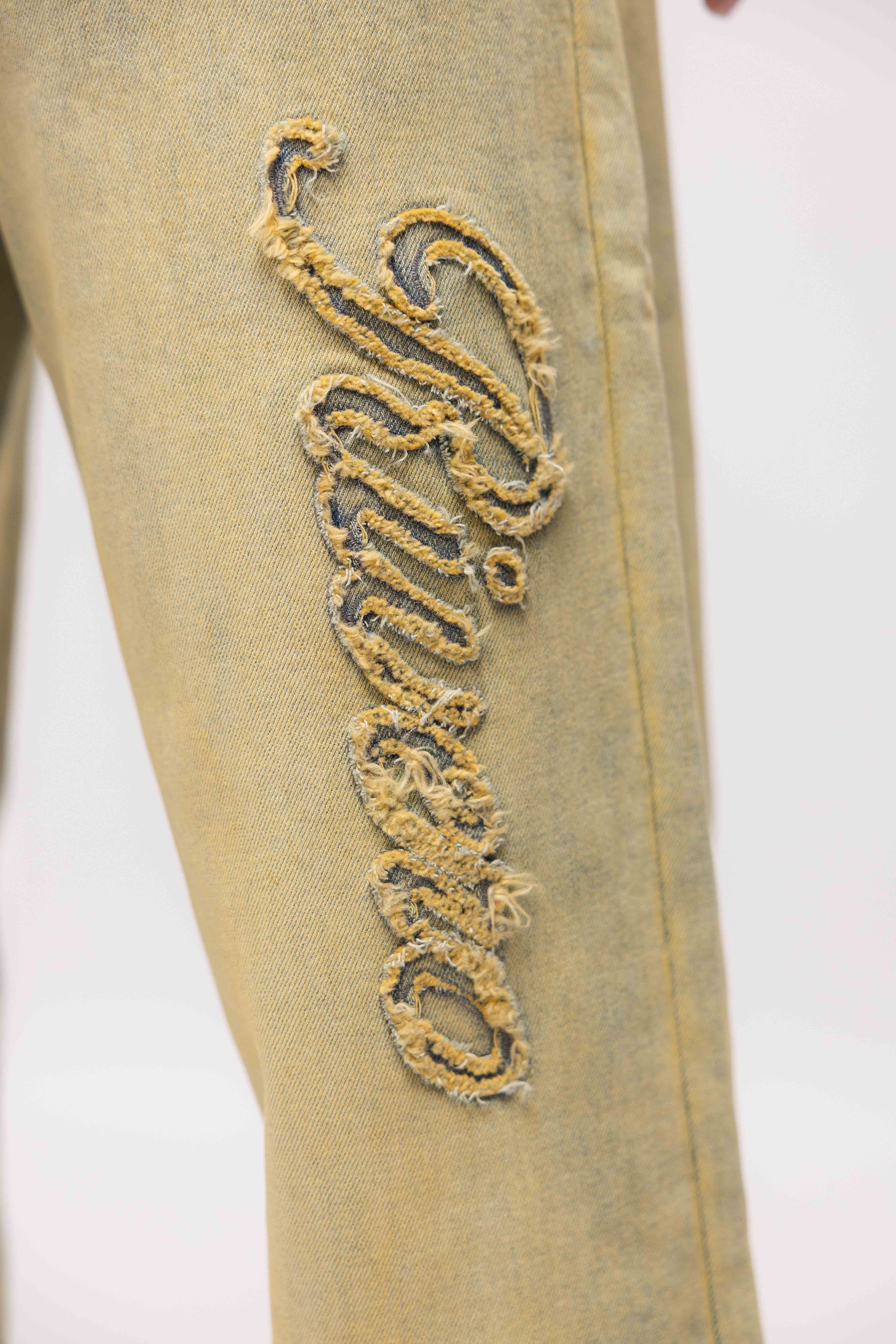 SCRIPT WASHED DENIM JEANS